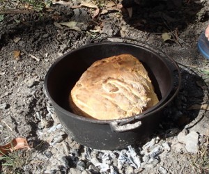 Camp oven damper with garlic, basil and oregano. Sensational.